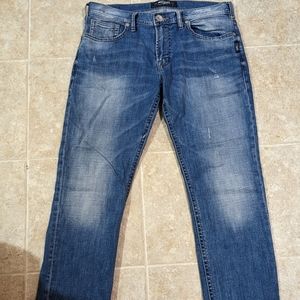 Blue and faded silver brand blue jeans